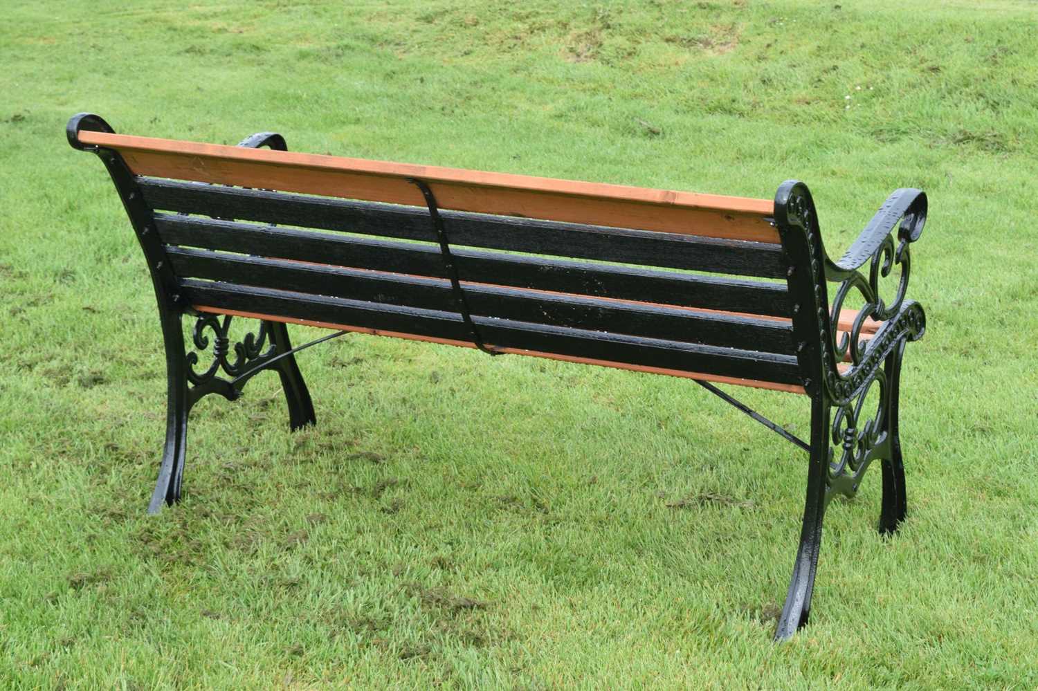 Modern two seater teak garden bench with cast metal ends - Image 5 of 6