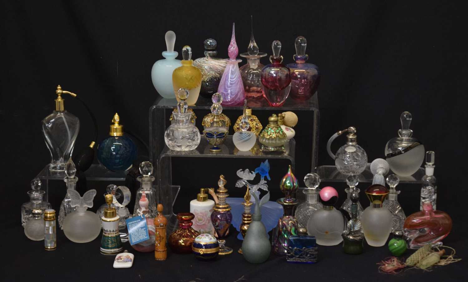 Quantity of modern glass scent and perfume bottles