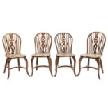 Four early 20th century elm and fruitwood wheel-back Windsor chairs