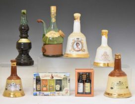 Three Bells whisky decanters, a selection of miniatures and liqueurs, etc