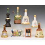 Three Bells whisky decanters, a selection of miniatures and liqueurs, etc