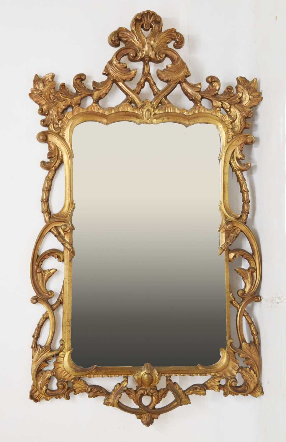 Large giltwood foliate scroll wall mirror