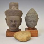 Two South East Asian grey stone busts and a carved stone fragment