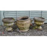 Pair of composition stone garden urns and Greek-style urn