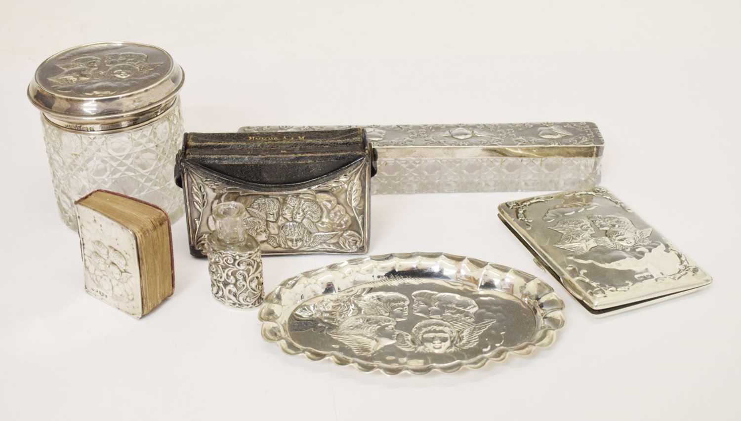 Collection of silver items each having embossed Reynold's cherubs decoration