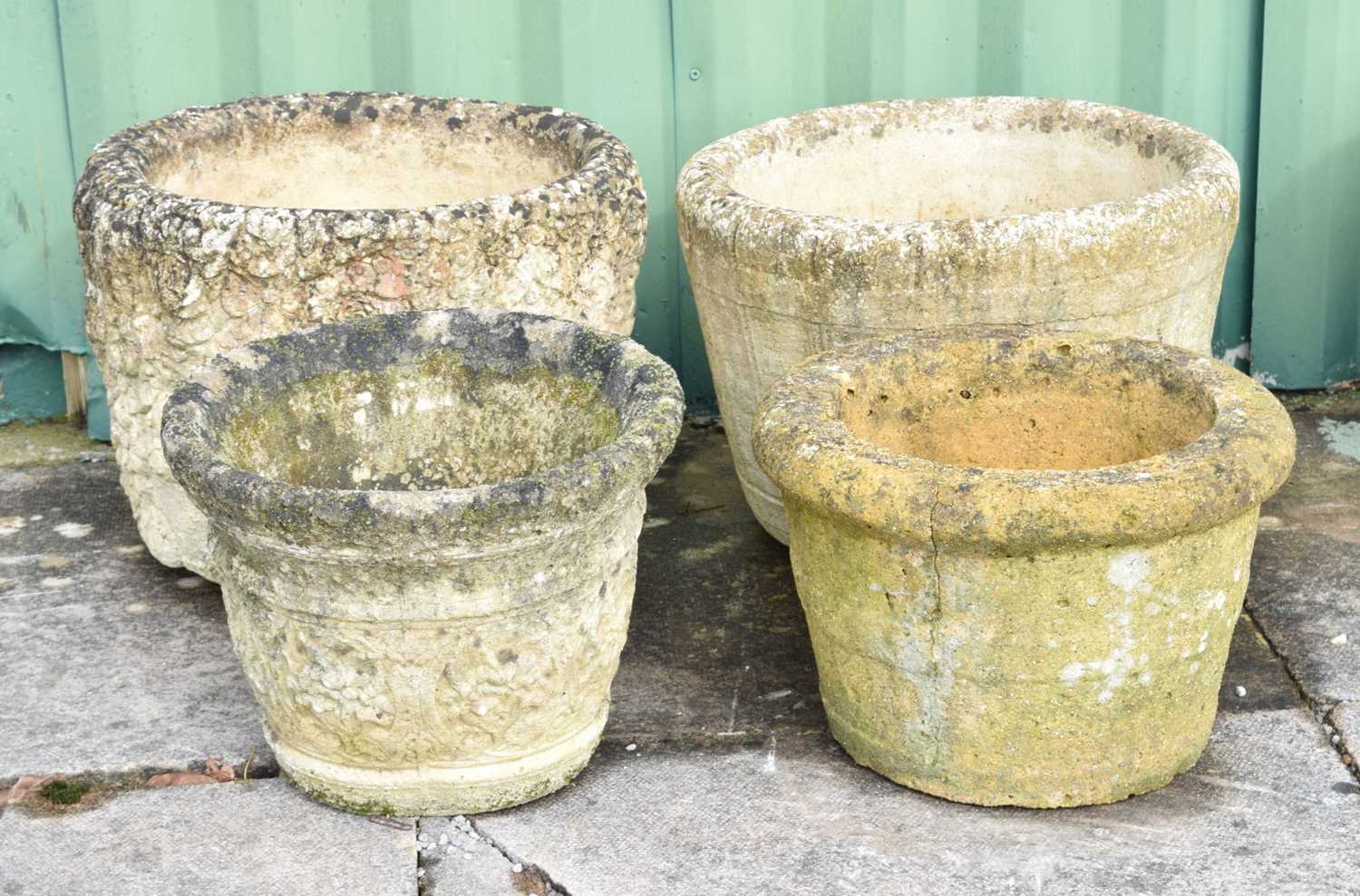 Four composite stone garden planters