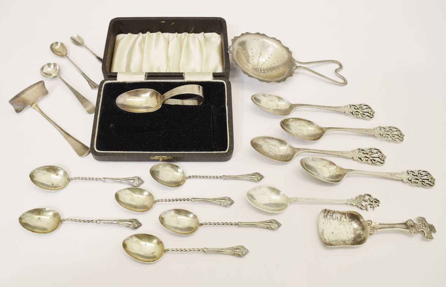 Assorted silver including four golfing spoons, tea strainer, George VI Scottish caddy spoon, etc