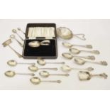 Assorted silver including four golfing spoons, tea strainer, George VI Scottish caddy spoon, etc