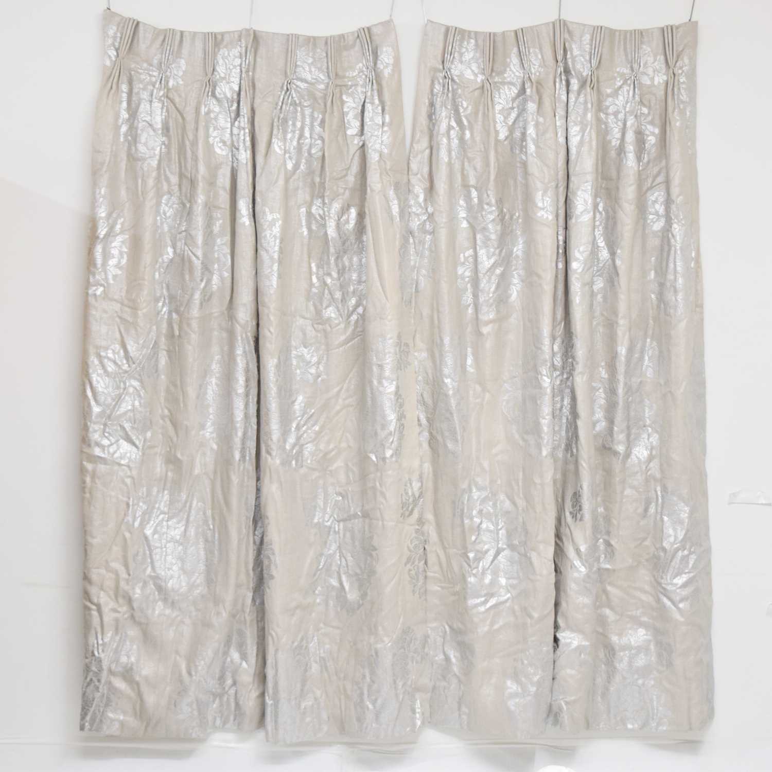 Three curtains, with silver printed floral design