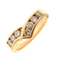 Unmarked yellow metal seven-stone diamond ring
