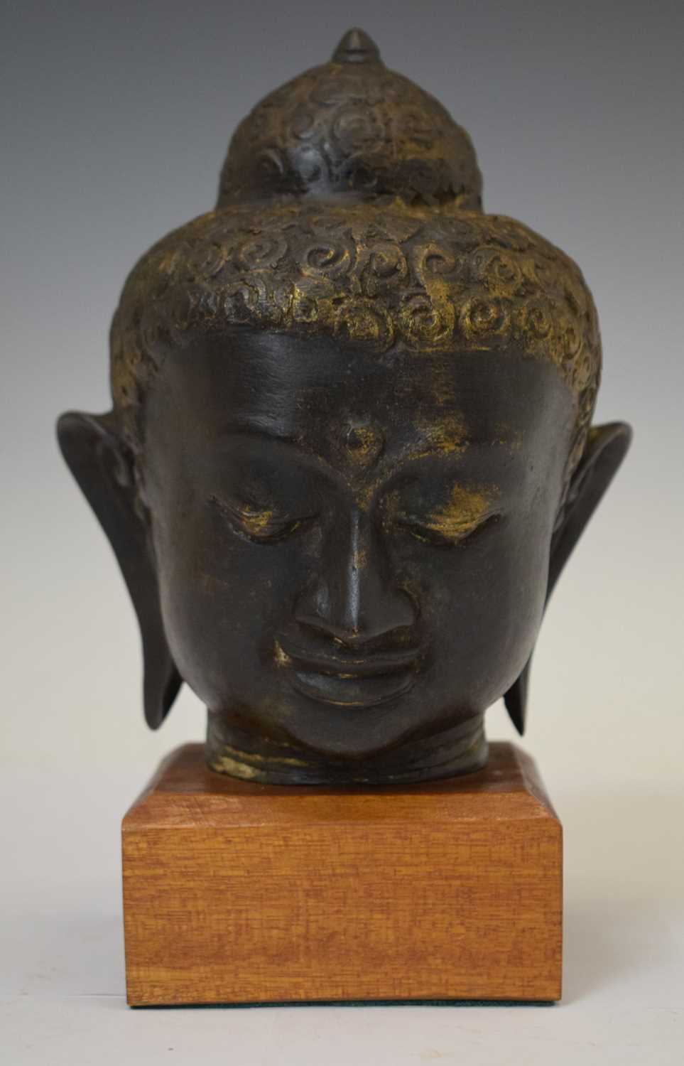 Bronzed bust of Buddha