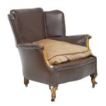 Early 20th century studded brown leatherette fireside chair