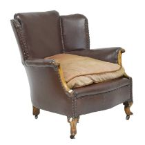 Early 20th century studded brown leatherette fireside chair