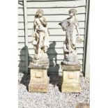 Two large composition stone garden statues of classical maidens