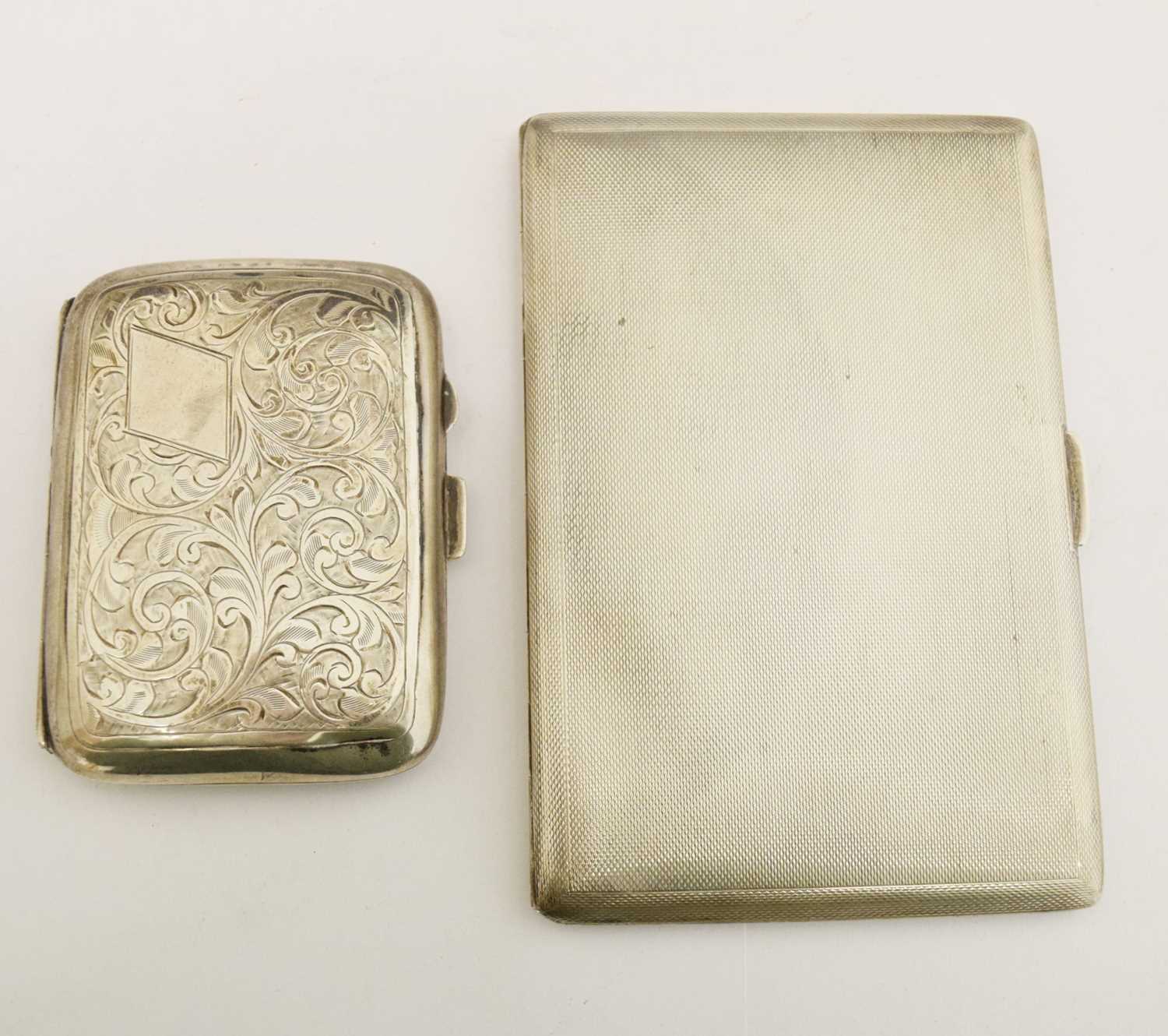 Two silver cigarette cases