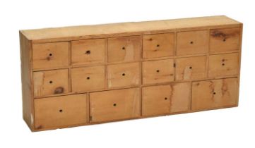 Bank of sixteen pine drawers