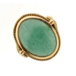Unmarked yellow metal ring set green cabochon