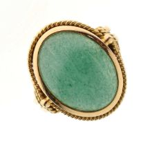 Unmarked yellow metal ring set green cabochon