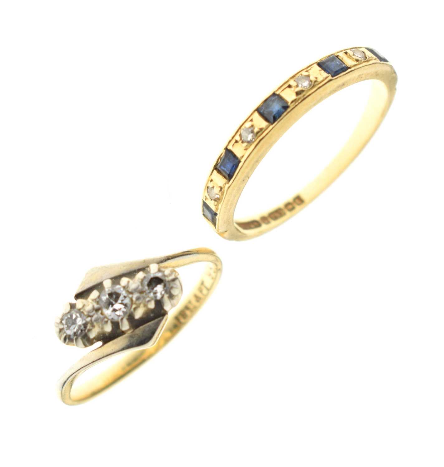 Diamond three-stone crossover ring, and a sapphire and diamond 18ct gold half eternity ring (2)