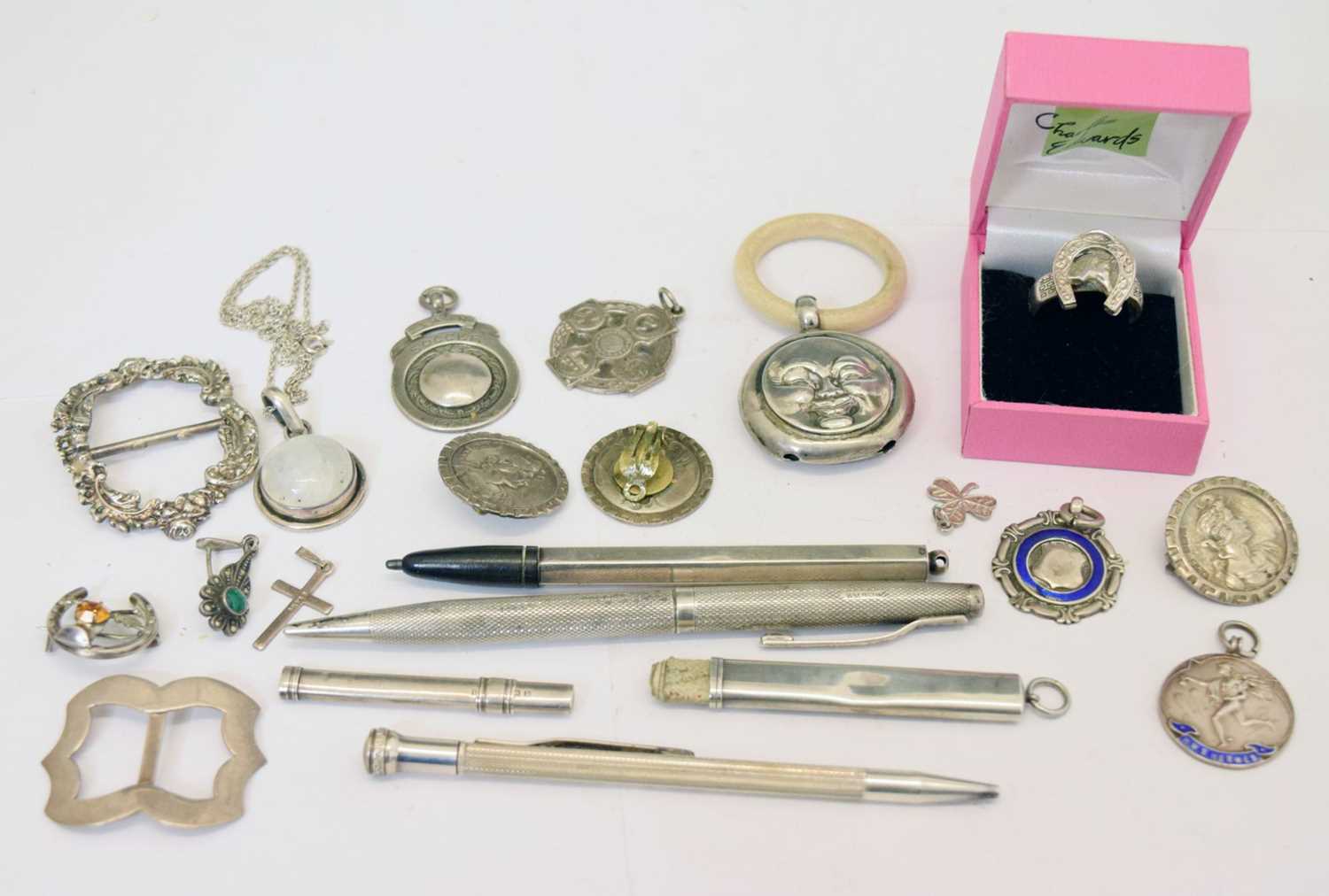 Quantity of silver fobs, buttons, a child's moon-faced teething ring/rattle, etc