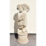 Composite stone garden statue of a cherub holding grapes