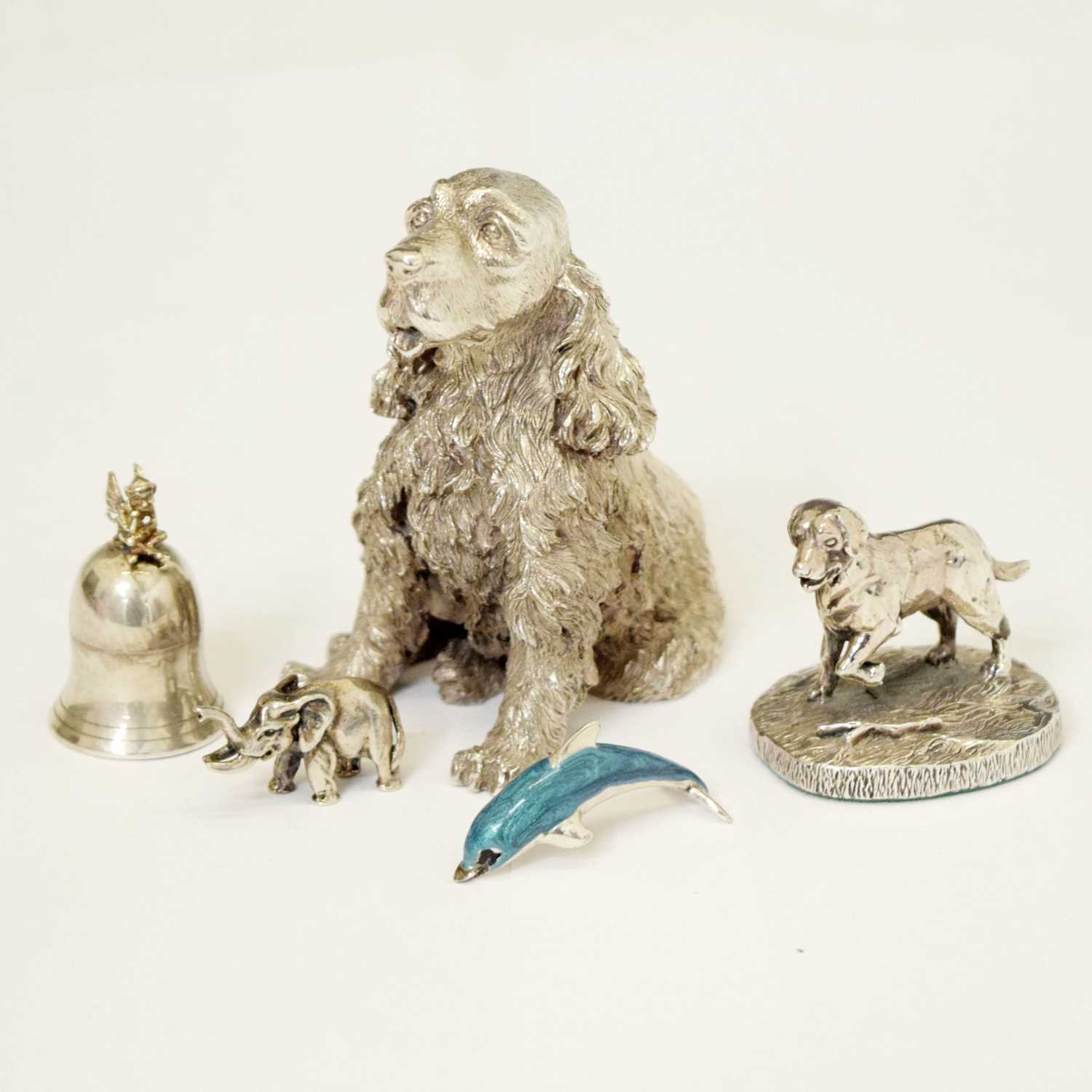 Silver and enamel figure of a dolphin, two Elizabeth II dog figures, etc