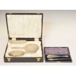 Cased Elizabeth II silver-backed dressing table set, and a silver handled shoe horn and button hook