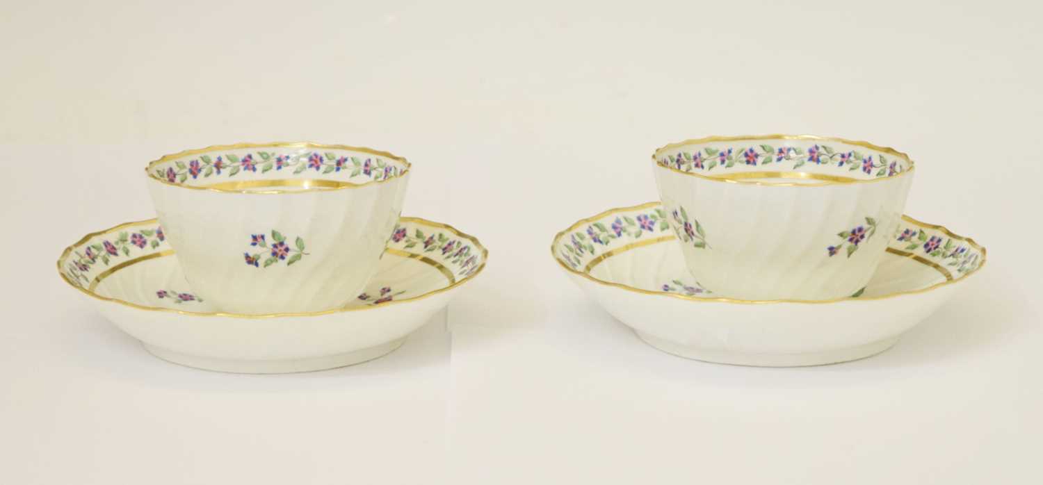 Pair of late 18th century New Hall-style spirally-fluted tea bowls and saucers