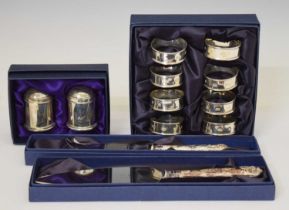 Set of six Elizabeth II silver napkin rings, salt/pepper set, etc