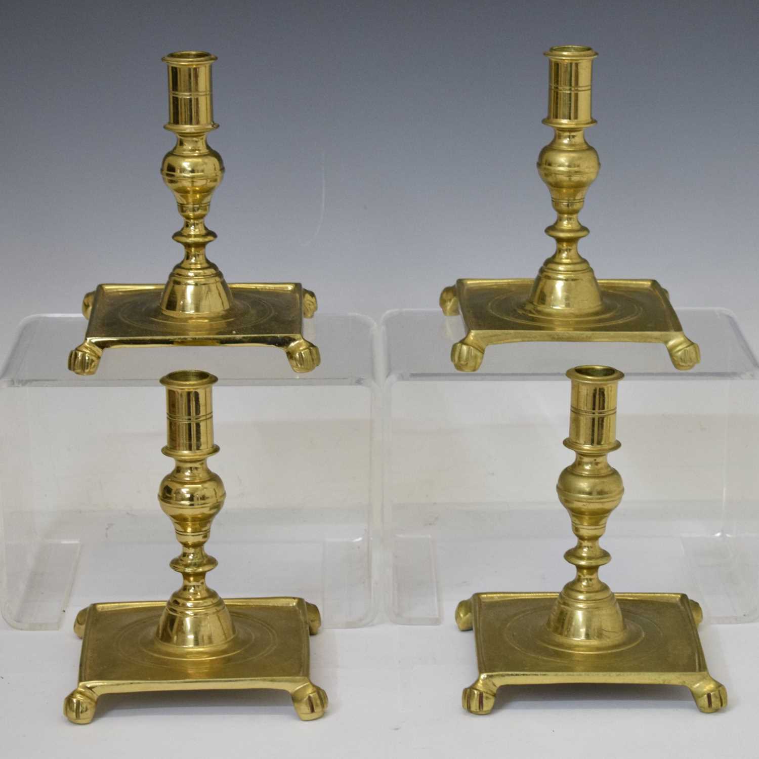 Four turned brass candlesticks
