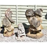 Group of three composition stone garden ornaments of gnomes