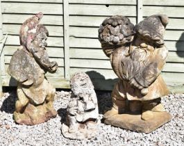 Group of three composition stone garden ornaments of gnomes