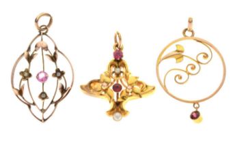 Three early 20th century stone set pendants