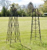 Two wrought iron bean frame obelisks