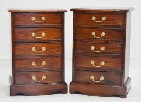 Pair of reproduction mahogany five-drawer bedside chests of drawers