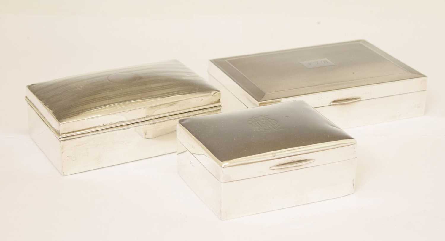 Three silver table top boxes