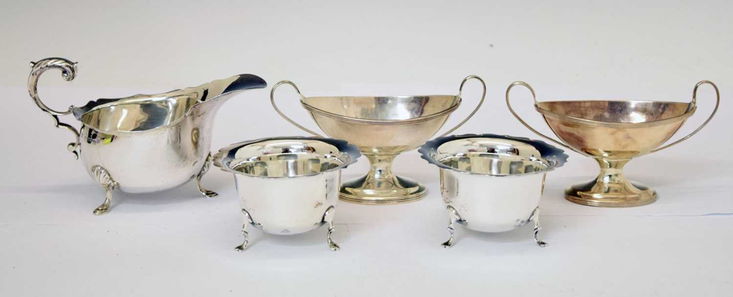 Pair of Victorian silver pedestal salts, an Edward VII silver sauceboat, etc