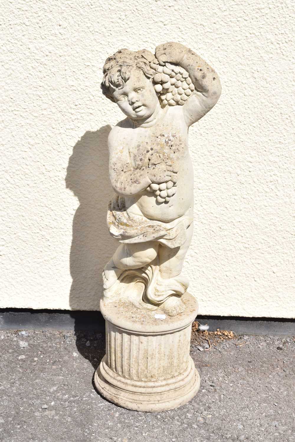 Composite stone garden statue of a cherub holding grapes - Image 2 of 7