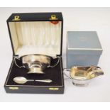Silver twin handled bowl and spoon, boxed and a silver sauce boat