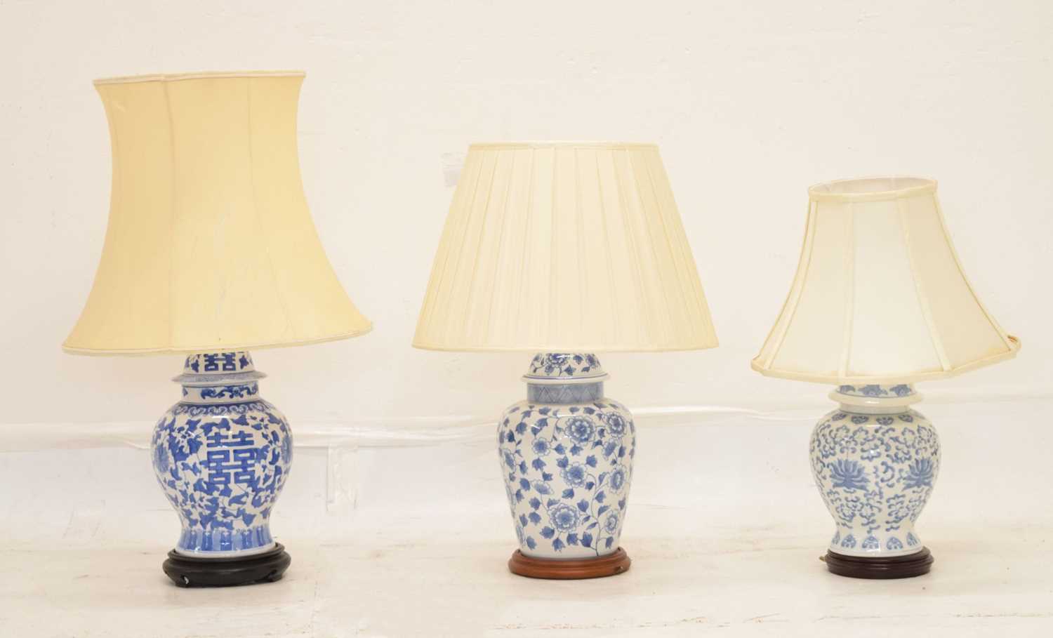 Three modern Chinese blue and white table lamps