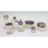 Collection of silver mounted and capped dressing table jars and pots