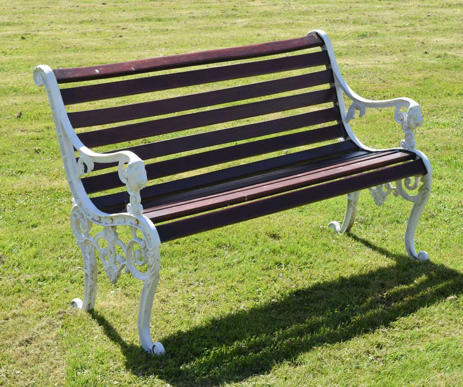 Two seater slatted wooden bench