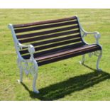 Two seater slatted wooden bench