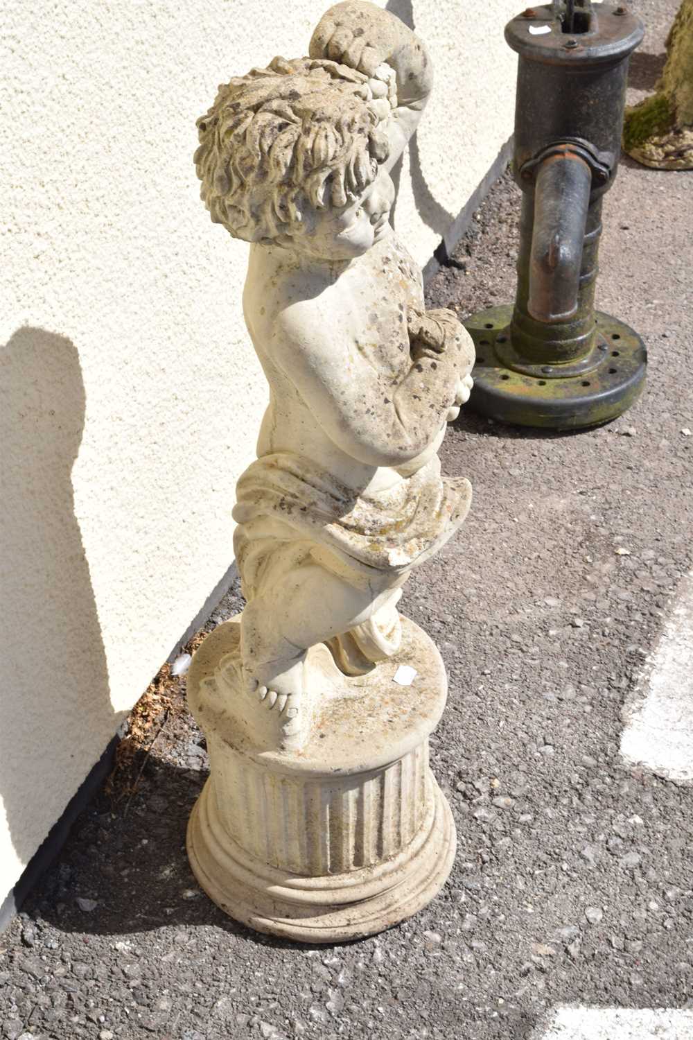 Composite stone garden statue of a cherub holding grapes - Image 3 of 7