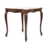 Edwardian carved walnut serpentine centre table