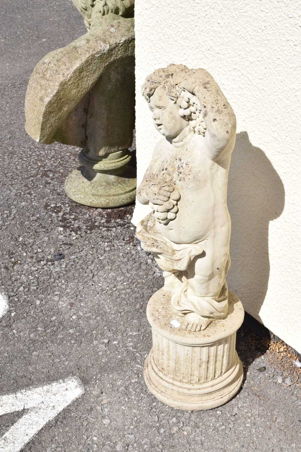 Composite stone garden statue of a cherub holding grapes - Image 4 of 7