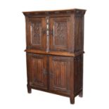 Early 20th century oak gothic revival two section cupboard