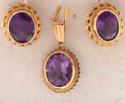 Pair of 9ct gold ear studs set amethyst-coloured oval faceted stones