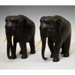 Pair of ebony elephants with ivory tusks