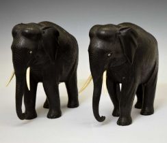 Pair of ebony elephants with ivory tusks